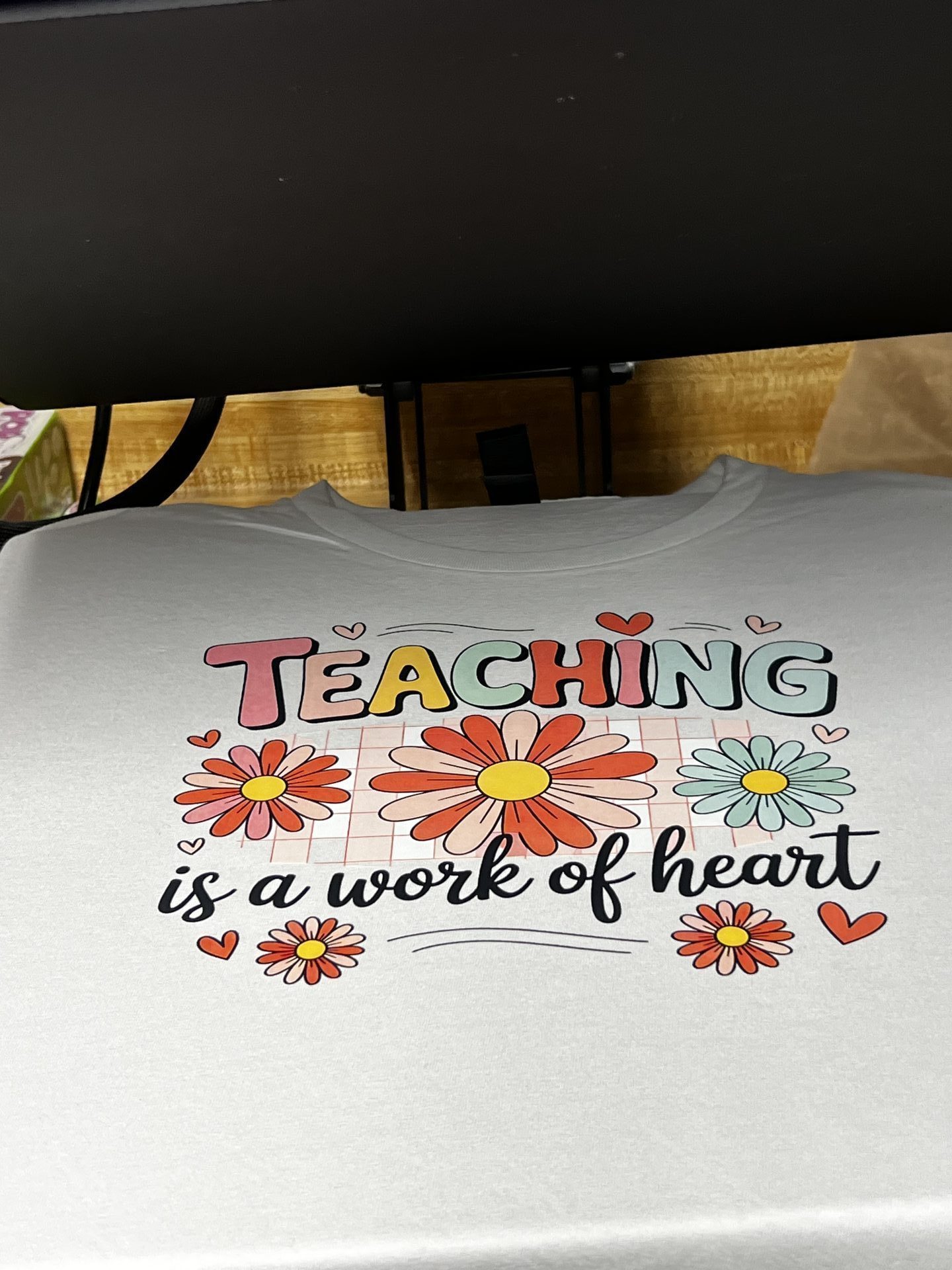 Custom white shirt with Teaching is a Work of Heart daisy floral design