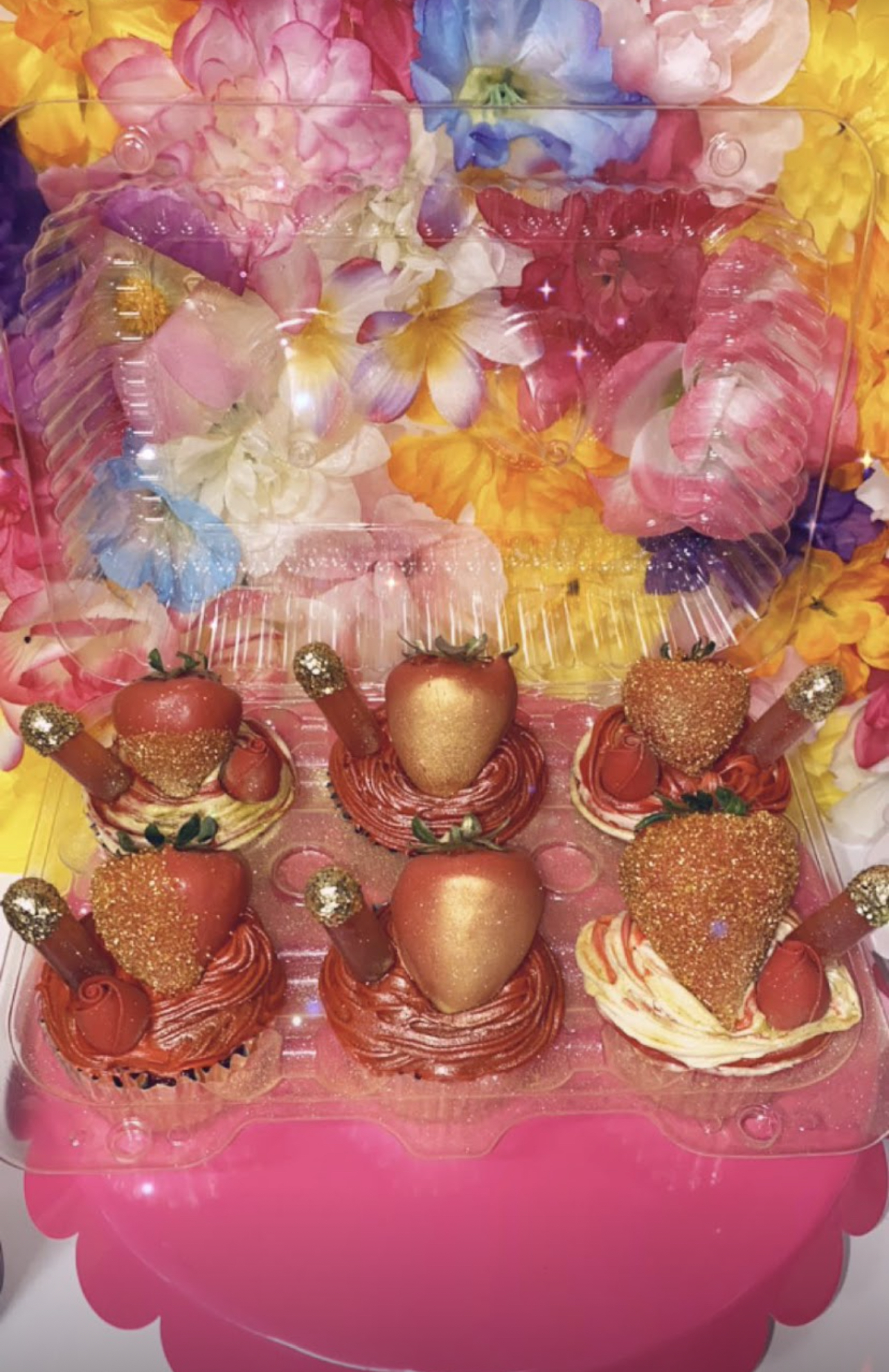 Gold dipped strawberries with decorated cupcakes